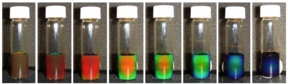 Image shows the solution of iron oxide in water changing color under a magnetic field, with increasing strength of the field from left to right. Photo credit: Yin laboratory, UCR.