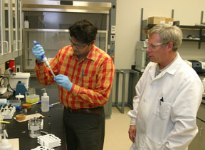 Formulation scientist Abhay Chauhan and producing chemist Doug Swanson of Dendritic Nanotechnologies Inc. produce a sample of dendrimers for fluorescence spectroscopy at CMUs Center for Applied Research and Technology. Dendrimer-based nanotechnology will be utilized in the creation of an advanced water purification system.

Photo by Robert Barclay
CMU Public Relations and Marketing