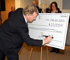 Cincom CEO Thomas Nies Signs Spirit of Enterprise MBA Business Plan Competition Grand Prize Check