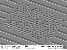 160nm wide holes positioned in concentric rings as used for photonics crystals. Printed in Amonil MM S4 on a SUSS MA6 Mask Aligner. Source: FhG/IZM