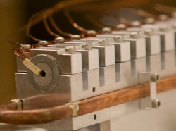  M. Raizen/Univ. of Texas

Reverse gun. As atoms pass through the atomic coilgun, high speed electronics turn on a 5-tesla magnetic "speed bump" from each coil. The system, combined with a new cooling technique, promises to trap and cool a wide range of atomic species.
