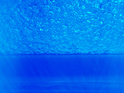 Nanoparticle additives to lubricants commonly combined with refrigerants used in chillers may encourage secondary nucleationbubbles on top of bubbles. The double-bubble effect enhances boiling heat transfer and, ultimately, could help to boost the energy efficiency of industrial-sized cooling systems.

Credit: NIST