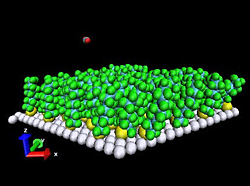Computer simulation of the JILA gas-liquid scattering experiments uses long molecules tethered to a surface as a useful stand-in for liquids, which are too complex for computer modeling. The speed of rotation of the carbon dioxide molecule after striking the surface is strongly dependant on its orientation, an effect caused by atomic-scale waves on the fluid surface.