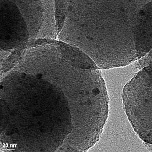 In this transmission electron micrograph of the mesoporous nanospheres, the nano-scale catalyst particles show up as the dark spots. Using particles this small (~ 3nm) increases the overall surface area of the catalyst by roughly 100 times.