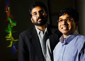 Photo by L. Brian Stauffer

Narayana R. Aluru, professor of mechanical science and engineering, left, and doctoral student Sony Joseph have discovered the physical mechanism behind the rapid transport of water in carbon nanotubes. Image in background shows the trajectory of water molecules in a carbon nanotube moving in the direction of their orientations due to rotation-translation coupling.