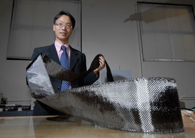 Jonghwan Suhr envisions using the pliable manufactured nanocomposites to allow airplanes and aerospace vehicles to cut through the air more efficiently, saving fuel. Photo by Crista Hecht.