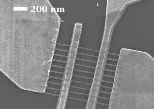 Image: Raghunath Murali
This scanning electron microscope image shows graphene nanoribbons that are 22 nanometers wide between the middle electrode pair.
