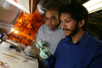 Assistant Professor of Physics James Dickerson (left) and graduate student Saad Hasan. (Photo by Daniel DuBois)