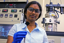Thiruvelu with a "Buckypaper" sheet
Bhuvana Thiruvelu, a postdoctoral research associate at the Birck Nanotechnology Center in Purdue's Discovery Park, demonstrates her research in which carbon nanotubes are grown from palladium nanoparticles on what's called a "buckypaper" sheet. (Purdue News Service photo submitted by Jeff Goecker)
