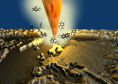 3D rendered image showing a heated nanoscale silicon tip, borrowed from atomic force microscopy that is chiselling away material from a substrate to create a nanoscale 3D map of the world.  As reported in the scientific journal Advanced Materials, IBM Researchers used this new nanopatterning technique to create the smallest map of the world in 3D, measuring only 22 by 11 micrometers was written  on a polymer - at this size 1000 world maps could fit on a grain of salt. In the relief, one thousand meters of altitude correspond to roughly eight nanometers (nm). It is composed of 500,000 pixels, each measuring 20 nm2 and was created in only 2 minutes and 23 seconds. (Image courtesy of Advanced Materials).