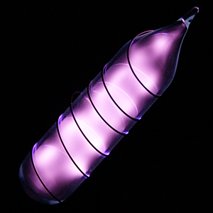 Vial of glowing untrapure helium.  Image by Jurii
