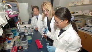Peixuan Guo, PhD, Dane and Mary Louise Miller Endowed Chair in biomedical engineering with students in his lab at the Vontz Center for Molecular Studies