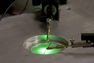 Researchers at Rensselaer Polytechnic Institute have developed a new method for manufacturing green LEDs with greatly enhanced light output. Led by Professor Christian Wetzel, the research team etched a nanoscale pattern at the interface between the LEDs sapphire base and the layer of gallium nitride (GaN) that gives the LED its green color. Overall, the new technique results in green LEDs with significant enhancements in light extraction, internal efficiency, and light output.

Rensselaer/Robbins