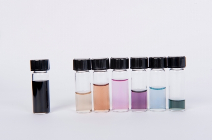 Armchair-enriched batches of nanotubes show their colors in an array of varying types. The vial at left is a mix of nanotubes straight from the furnace, suspended in liquid. The vials at right show nanotubes after separation through ultracentrifugation. Excitons absorb light in particular frequencies that depend on the diameter of the tube; the mix of colors not absorbed are what the eye sees. (Credit: Erik Hroz/Rice University)