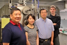 University of Georgia researchers, left to right, Yao-Wen Huang, Jing Chen, Yiping Zhao and Justin Abell stand in front of an electron beam evaporator at the UGA Nanoscale Science and Engineering Center. The instrument, designed and created by the UGA Instrument Shop, is used to deposit silver nanorods 1,000 times finer than the width of a human hair on a chip that can be used to detect viruses, bacteria and chemical contaminants.