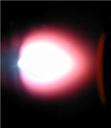 Using a high-power, pulsed laser to deposit materials from a plasma plume (shown here), researchers synthesized materials to study their unique pyroelectric properties at the nanoscale.