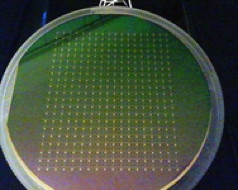 This wafer of nanocrystalline diamond provides one example of the technology that AKHAN Technologies has licensed from Argonne. To view a larger version of the image, click on it. Photo courtesy Ani Sumant.
