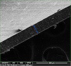 A composite material created at Rice University is nearly impervious to gas and may lead to efficient storage of compressed natural gas for vehicles. A 65-micrometer-wide polymer film, photographed edge-on with an electron microscope, contains a tiny amount of enhanced graphene nanoribbons that present gas molecules a tortuous path to escape.Credit: Changsheng Xiang/Rice University