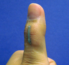 A sensor based on silver nanowires is mounted onto a thumb joint to monitor the skin strain associated with thumb flexing. The sensor shows good wearability and large-strain sensing capability.Photo: Shanshan Yao.