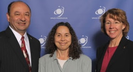 Lynne Zielinski (center) with NASA astronauts Mark Polansky and Sandra Magnus, Ph.D., at Space Foundation World Headquarters in Colorado Springs