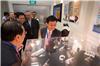 Senior Minister of State Lee Yi Shyan looking at 3D-printed jewellery at the launch of NTU Additive Manufacturing Centre