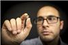 Researcher Dr Amgad Rezk with the lithium niobate chip.