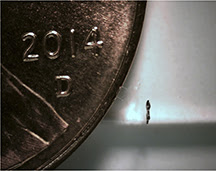 This is a side view of the microrobot next to a U.S. penny.Purdue University photo