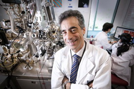 QUT's Professor Nunzio Motta with one of the university's powerful nanotechnology microscopes.