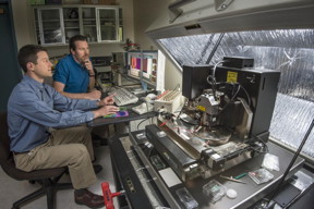 Sandia National Laboratories researchers Jon Ihlefeld, left, and David Scrymgeour use an atomic-force microscope to examine changes in a material's phonon-scattering internal walls, before and after applying a voltage. The material scrutinized, PZT, has wide commercial uses.
CREDIT" Randy Montoya, Sandia National Laboratories