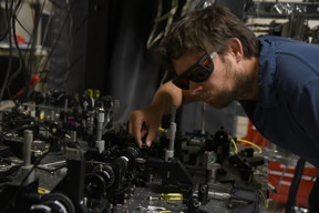 NIST physicist Krister Shalm with the photon source used in the 'Bell test' that strongly supported a key prediction of quantum mechanics: There are in fact 'spooky actions at a distance.'
CREDIT: Burrus/NIST