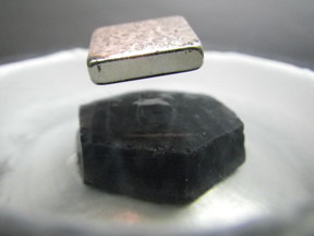 A magnet levitating above a cuprate high temperature superconductor.
New findings from an international collaboration led by Canadian scientists may eventually lead to a theory of how superconductivity initiates at the atomic level, a key step in understanding how to harness the potential of materials that could provide lossless energy storage, levitating trains and ultra-fast supercomputers.
CREDIT: Robert Hill/University of Waterloo