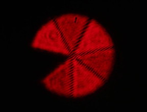To characterize twisted light the researchers looked at the images produced by the interference of a structured laser beam with a replica of that beam rotated by a given angle, including this "Pac-Man."
CREDIT: Mohammad Mirhosseini