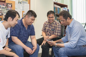 Part of the team members from NUS Nanoscience and Nanotechnology Institute are: (from left to right) Dr. Renshaw Wang, Dr. Huang Zhen, Assistant Professor Ariando and Professor T. Venkatesan. They are looking at a four-inch wafer on which a multi-component oxide film has been deposited using the pulsed laser deposition process.
CREDIT: NUS Nanoscience and Nanotechnology Institute