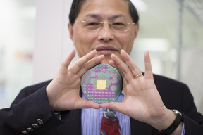 RMIT University's Professor Min Gu with the breakthrough nanophotonic chip that can harness the angular momentum of light.
CREDIT: RMIT University