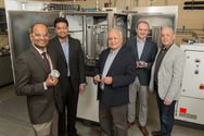 rgonne researchers, from left, Subramanian Sankaranarayanan, Badri Narayanan, Ali Erdemir, Giovanni Ramirez and Osman Levent Eryilmaz show off metal engine parts that have been treated with a diamond-like carbon coating similar to one developed and explored by the team. The catalytic coating interacts with engine oil to create a self-healing diamond-like film that could have profound implications for the efficiency and durability of future engines. photo by Wes Agresta