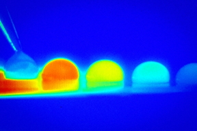 In a time-lapse sequence, infrared imaging shows the temperature changes within a droplet of water as it moves across a treated silicon surface in response to temperature differences on that surface.

Image courtesy of N. Bjelobrk/Varanasi Research Group. Edited by MIT News