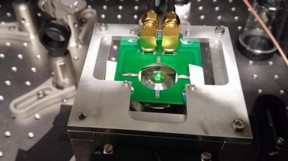 This photo shows a diamond sample illuminated by green light in home-built microscope. The sample is placed on a special mount, within a printed circuit board, used to deliver microwaves which allow quantum manipulations and magnetic sensing with the NVs.
CREDIT
(Credit: Yoav Romach)