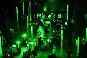 Using ultracold lithium atoms confined by intersecting laser beams, physicists from Rice University and the University of Geneva confirmed a 1963 prediction that the charge wave from an excited electron moves faster in a one-dimensional electron gas as interaction strength between the electrons increases.

CREDIT
Jeff Fitlow/Rice University