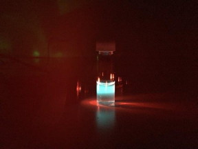 Organic nanoparticles in a vial convert invisible near-infrared light to intense blue light, which can easily be seen by human eyes.
Credit: Gang Han 