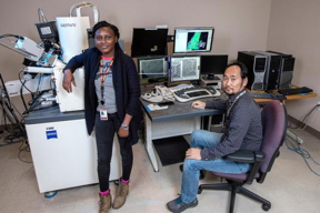 Abiola Temidayo Oloye, left, a fifth-year doctoral candidate and the lead author of a study published in Superconductor Science and Technology, at an electron microscope with Fumitake Kametani, an associate professor of mechanical engineering and principal investigator for the study at the FAMU-FSU College of Engineering.

CREDIT
Mark Wallheiser/FAMU-FSU College of Engineering