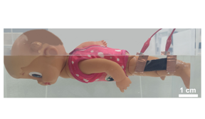 An underwater movement sensor attached to a motorized swimming doll’s knee alerts a smartphone app when the doll stops kicking, simulating a swimmer in distress.

CREDIT
Adapted from ACS Nano 2022, DOI: 10.1021/acsnano.2c08325