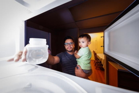 Kazi Albab Hussain (left) holds his son while removing a plastic container of water from a microwave. Hussain and colleagues at the University of NebraskaLincoln have found that microwaving such containers can release up to billions of nanoscopic particles and millions of microscopic ones.

CREDIT
Craig Chandler, University of NebraskaLincoln