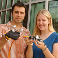 Boris Mizaikoff displays a prototype of the gas phase sensor, while graduate student Christy Charlton holds the liquid phase prototype