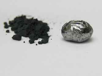 UCLA scientists have made rhenium diboride, an ultra-hard material. Rhenium diboride is seen here in powder form (left), made from heating the elements in a furnace, and as a pellet made by a procedure called arc melting.  