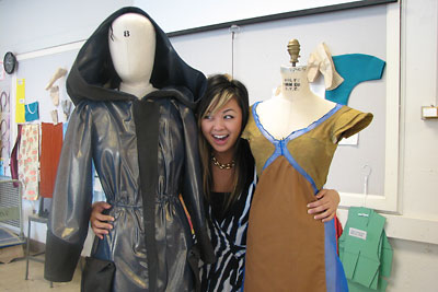Anne Ju/Cornell Chronicle
Design student Olivia Ong '07 hugs two garments, treated with metallic nanoparticles through a collaboration with fiber scientists Juan Hinestroza and Hong Dong, that she designed as part of her fashion line, "Glitterati."