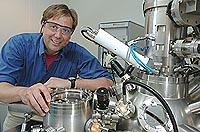 Matthias Bode, Center for Nanoscale Materials, is shown with his enhanced spin polarized scanning tunneling microscope (SP-STM). His enhanced technique allows scientists to observe the magnetism of single atoms. Use of this method could lead to better magnetic storage devices for computers and other electronics.