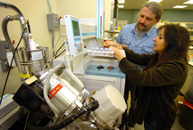 Discovery Park researchers Jiri Adamec, left, and Maria Sepulveda analyze molecule samples taken using gas chromatography coupled with a mass spectrometer at a laboratory in Discovery Park's Bindley Bioscience Center. Adamec, a faculty researcher in metabolomics and proteomics, and Sepulveda, an assistant professor in the Department of Forestry and Natural Resources, are examining the development of biomarkers in fish that have been exposed to chemicals and contaminants such as herbicides. The research has applications in how humans might adversely react to the same chemicals. Public tours beginning Oct. 1 at Discovery Park will include the Bindley Bioscience and Birck Nanotechnology centers as well as Mann Hall and the Burton D. Morgan Center for Entrepreneurship. (Purdue News Service photo/ David Umberger)