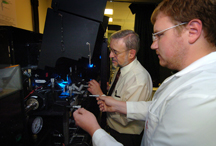 James Leary, from left, a School of Veterinary Medicine professor of nanomedicine and professor of biomedical engineering at Purdue, and Michael Zordan, a graduate student in biomedical engineering, prepare samples for a special high-speed cell sorter at Discovery Park's Bindley Bioscience Center. This instrument, located in Bindley's Molecular Cytometry Laboratory, is a key part of a $4.5 million project that combines molecular imaging, cytometry and nanomedicine to diagnose and treat illnesses and diseases at the molecular level. (Purdue News Service photo/David Umberger)
