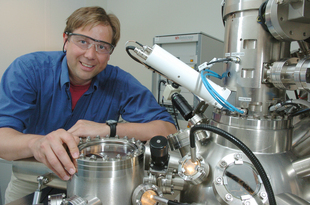 Matthias Bode, Center for Nanoscale Materials, is shown with his enhanced spin polarized scanning tunneling microscope (SP-STM). His enhanced technique allows scientists to observe the magnetism of single atoms. Use of this method could lead to better magnetic storage devices for computers and other electronics.