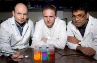 Clarkson University Physics Professor Igor Sokolov and his team have discovered a method of making the brightest ever synthesized fluorescent silica particles. Here (left to right) Sokolov works in his laboratory with graduate student Dmitry Volkov and postdoctoral fellow Sajo P. Naik. sokolov-particles: Fluorescent image of a physical mixture of fluorescent silica particles of different shapes with different dyes.